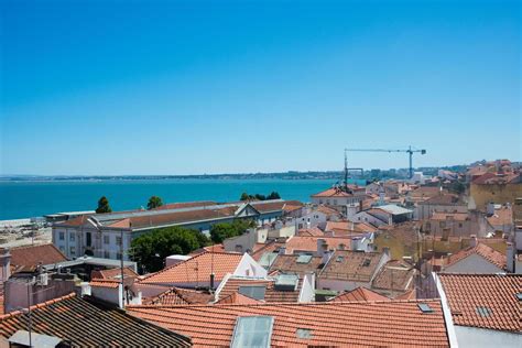 Aerial view of Lisbon rooftops and river. Portugal 5202927 Stock Photo at Vecteezy