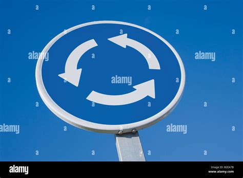 Traffic sign roundabout Stock Photo - Alamy