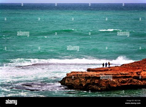 Rock Fishing Beachport Stock Photo - Alamy