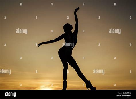 Set yourself free. Girl silhouette on evening sky. Free dance. Dancing ...