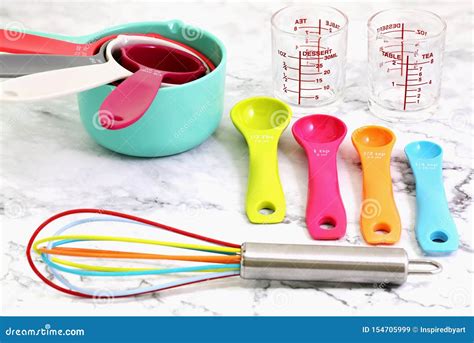 Set of Measuring Cups, Measuring Spoons, Measuring Glasses and Silicone Whisk Use in Cooking Lay ...