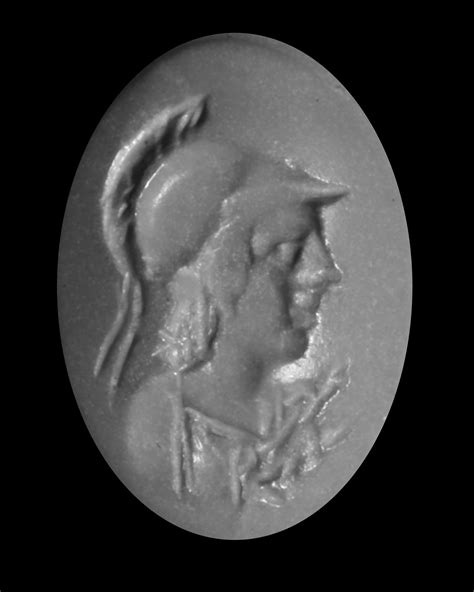 A ROMAN INTAGLIO OF MINERVA IN CHROME BERYL, 1ST CENTURY AD