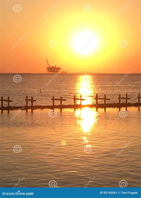 Oil rig sunset stock image. Image of harbor, dock, pier - 95745541