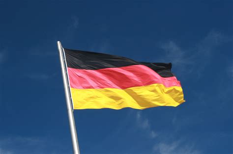 File:German Flag Flying aganist a Blue Sky.jpg - Wikimedia Commons