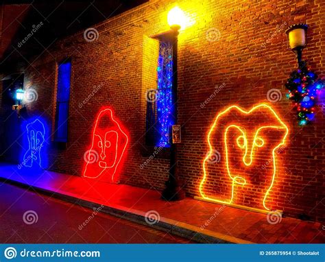 Super Glow Blue, Red and Yellow Men at the Georgetown Glow Exhibit Editorial Stock Image - Image ...