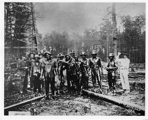 Drilling crew covered with oil in Smackover oil field – History Alive ...