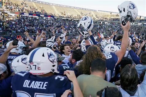 UConn football upsets Liberty for sixth win of season.