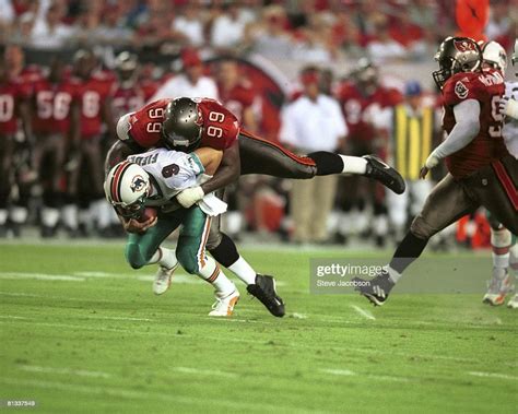 Tampa Bay Buccaneers Warren Sapp in action vs Miami Dolphins QB Jay ...