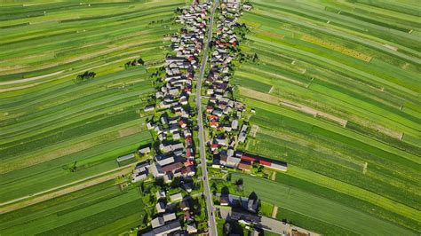 Aerial view of decorative ornaments of diverse green fields and houses ...