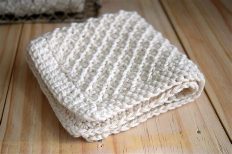 Hand Knit Daisy Stitch Washcloth Pattern • Nourish and Nestle