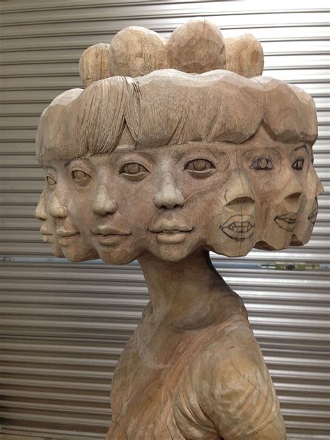 Japanese Artist Turns Wood Into Twelve-Faced Girl And Other Weird Sculptures