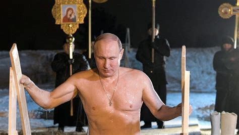 Shirtless Vladimir Putin dunks himself in icy water to mark Epiphany