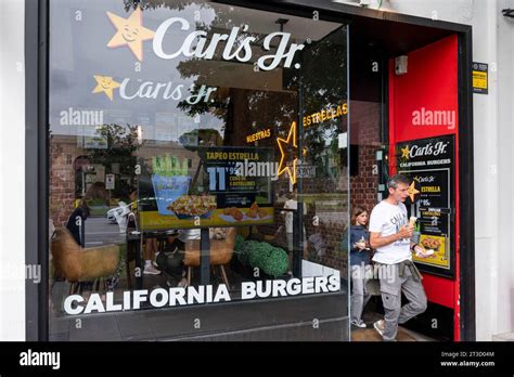 Customers leave the American fast food restaurant chain Carl's Jr (Carls Jr) in Madrid Stock ...