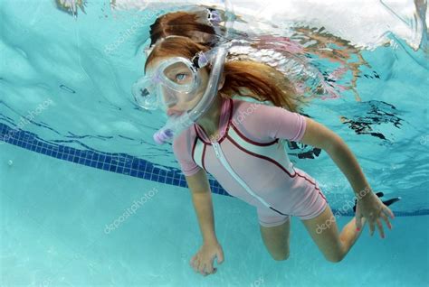 Child swimming underwater in pool Stock Photo by ©ftlaudgirl 30281093