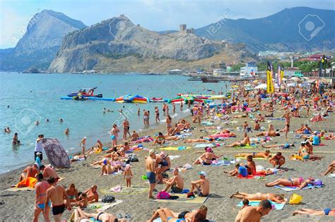 SUDAK, UKRAINE - SEPT 08, 2015: People at a sea beach in Sudak ...