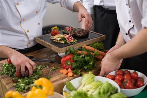 team cooks and chefs preparing meal 12110313 Stock Photo at Vecteezy