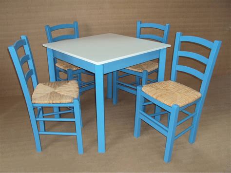 Hand made chairs and tables, traditional of a Greek tavern, painted in blue and white, the ...