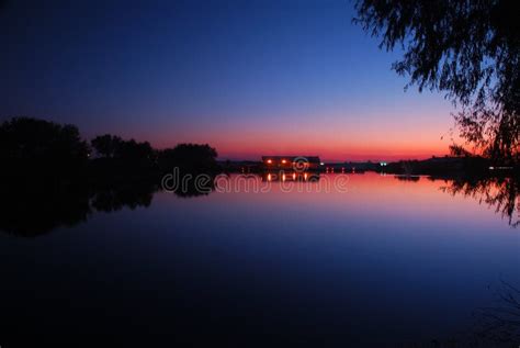 Sunset over calm lake stock image. Image of calm, scenery - 3563085