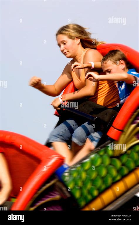 Kids on a carnival ride Stock Photo - Alamy