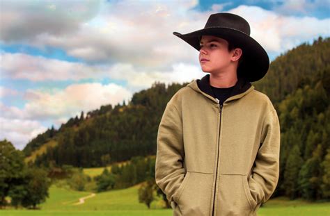 boy with cowboy hat and mountains - Wyoming Department of Health