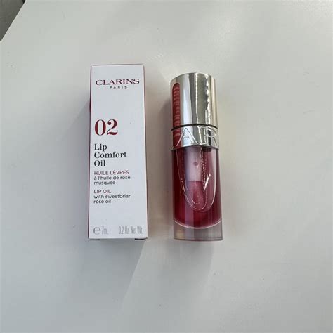 Clarins Lip Comfort Oil Color: 02 Raspberry Retails... - Depop