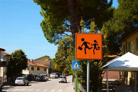 Premium Photo | Children crossing road sign on city street space for text