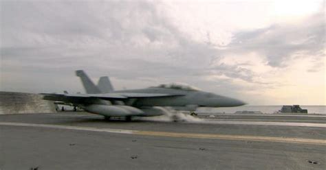 Rescue underway after Navy plane crashes off Japan coast - CBS News