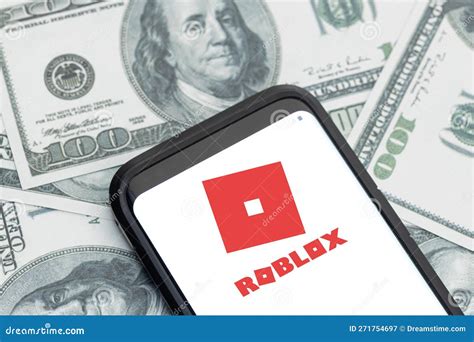 Roblox Company Logo on Smartphone Screen and Dollar Banknotes Background Editorial Photography ...