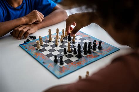 Hands In Action Two Black Kids Play Chess At Home Stock Photo - Download Image Now - iStock