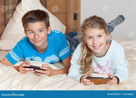 Kids Playing with Smartphone on a Bed Stock Image - Image of communication, children: 60787067