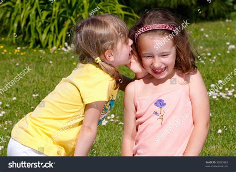 Two Girls Whispering Secrets To Each Other Stock Photo 32823883 : Shutterstock