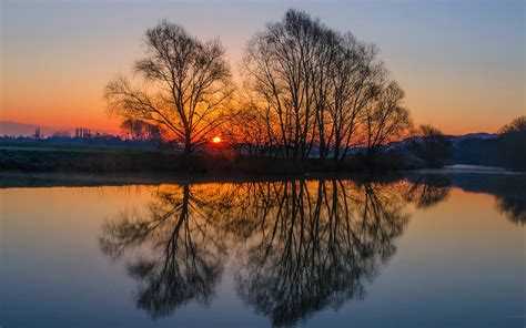 England landscape, evening sunset, trees, river, water surface ...