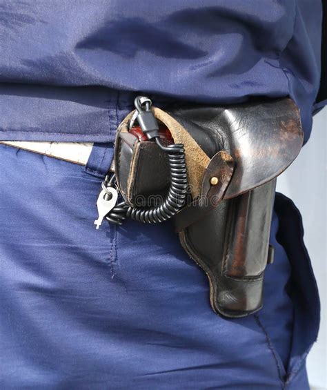 Gun in the Holster on the Belt of a Policeman Stock Photo - Image of closeup, blue: 147045248