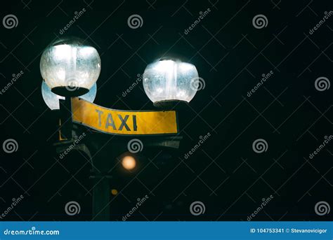 Taxi stand sign at night stock image. Image of copy - 104753341