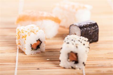 Sushi pieces on sushi mat stock photo. Image of assortment - 57753554