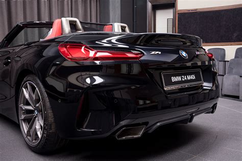 BMW Z4 M40i featured in Sapphire Black Metallic with Magma Red interior