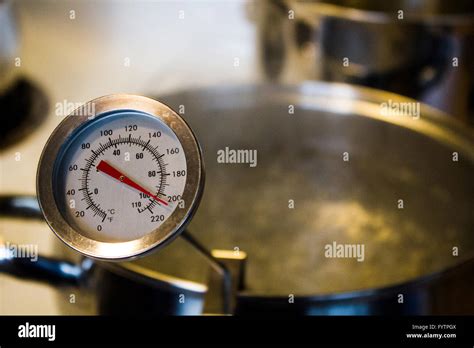 Boiling Water in Pot with Thermometer. Part of Home Brewing Series Stock Photo - Alamy