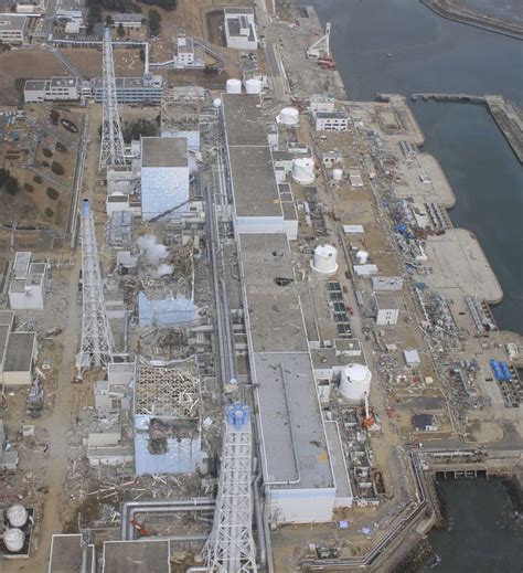 Aerial photograph of the damaged Fukushima Daiichi nuclear power plant, 20 and 24 March 2011 ...