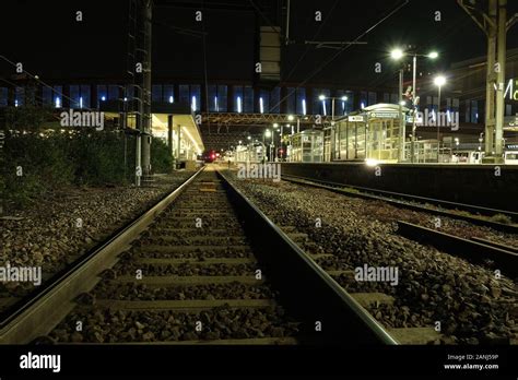 Train Tracks At Night Stock Photo - Alamy