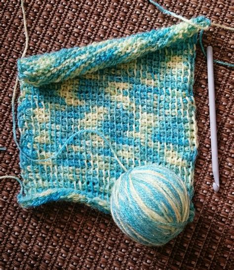 My Tunisian Simple Stitch scarf in the making.😊 | Knitted hats, Stitch, Collection box