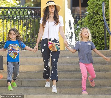 Megan Fox exudes hot mama style as she stays cool in an oversized hat ...