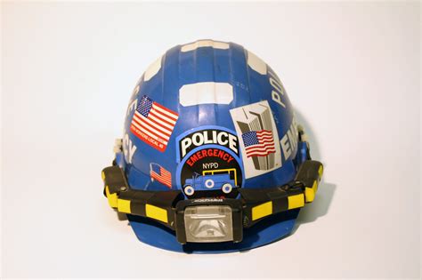 Hardhat worn by Detective Tony Favara of NYPD ESU Truck 6 / Gift of Detective Tony Favara, NYPD ...