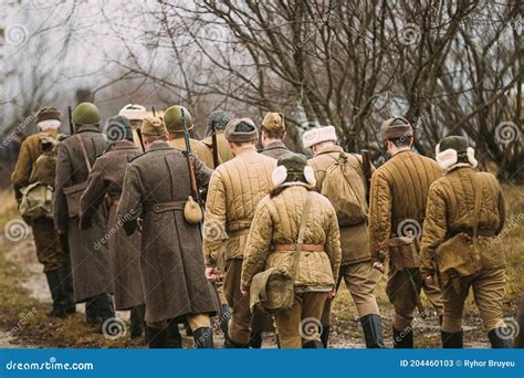 Re-enactors Dressed As World War II Russian Soviet Red Army Soldiers Marching through Forest ...