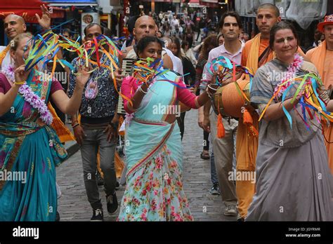 ISKCON devotees performing a harinam (devotional walk with dancing and chanting) in Paris ...