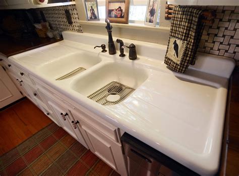 White Wooden Storage Cabinet With Double Cast Iron Sink And Drainboard ...