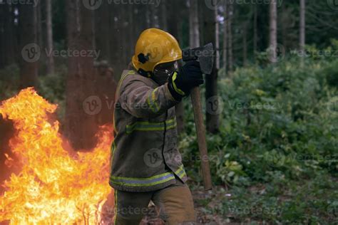 Firefighter in action 11593889 Stock Photo at Vecteezy