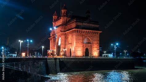 Mumbai's gate of india at night with illuminated lights Stock Photo ...