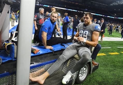 Detroit Lions' T.J. Hockenson in boot after suffering late leg injury