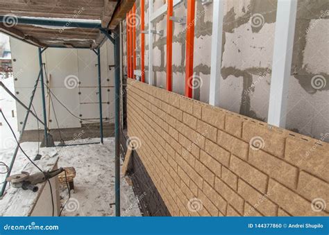 Installing Brick Siding on the Wall of the House Stock Photo - Image of panels, repair: 144377860