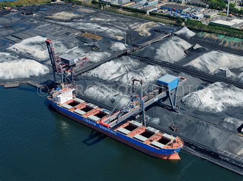 aerial view | Amsterdam, a bulk carrier unloads a load of coal at the quay of the OBA bulk ...